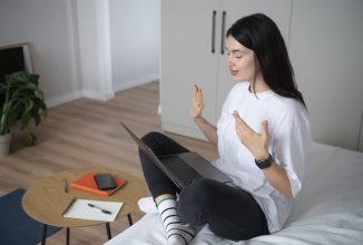 woman-talking-using-her-laptop-home-quarantine